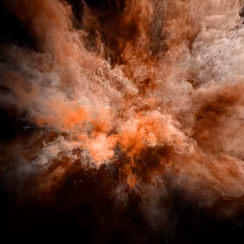 a dust explosion against dark background